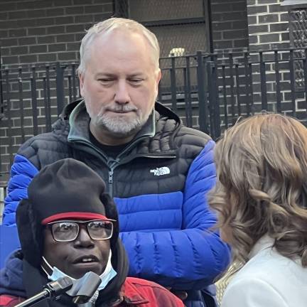 One supporter of Law-Gisiko’s (left, Yankees glove) said that they had left a dialysis appointment to attend the rally.