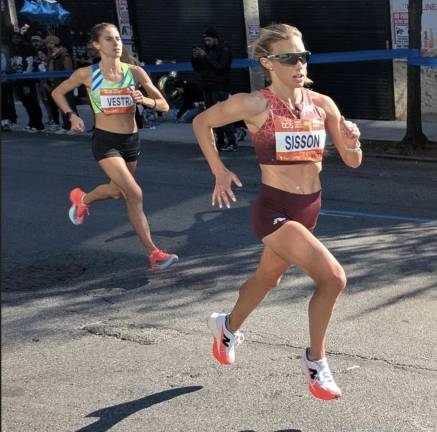 Emily Sisson, eventual eigplace women’s finisher, on Rider Avenue, the Bronx.