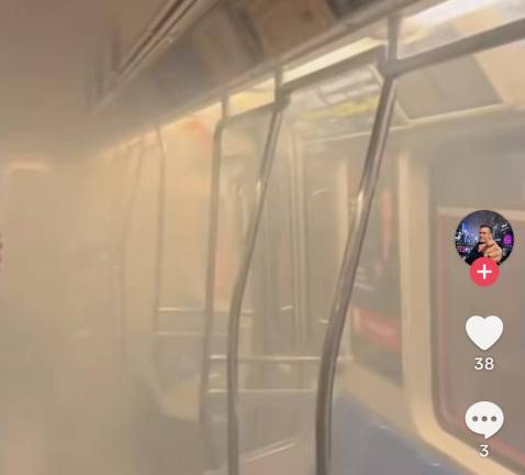 The PATH filling with smoke as passengers frantically try to evacuate