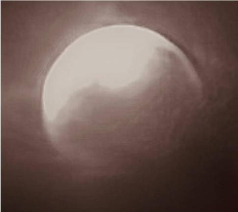 The lunar eclipse was visible in New York City despite cloudy skies on the evening of Aug. 27. At times, the earth cast a reddish shadow on the moon, creating what is known as the “blood moon.”
