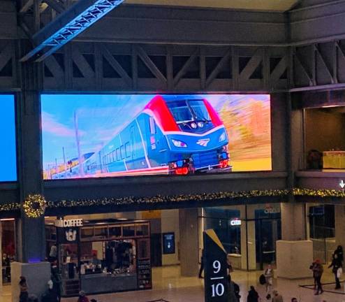 Above the departure level of the not quite two-year old Moynihan Train Hall, an Amtrak Airo image is on view for passengers on December 15. Photo: Ralph Spielman