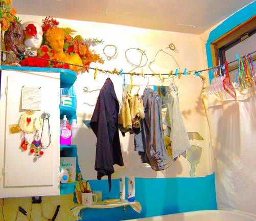 Clothes hang over the tub in an East Village apartment. The tenant has lived in the neighborhood since 1981.