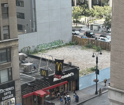 A view overlooking the vacant lot located at the northeast corner of 8th Avenue and 34th Street, on which Vornado plans to build a 38-story mixed-use tower, incorporating the existing entrance to 34th Street–Penn Station into the tower’s ground floor.