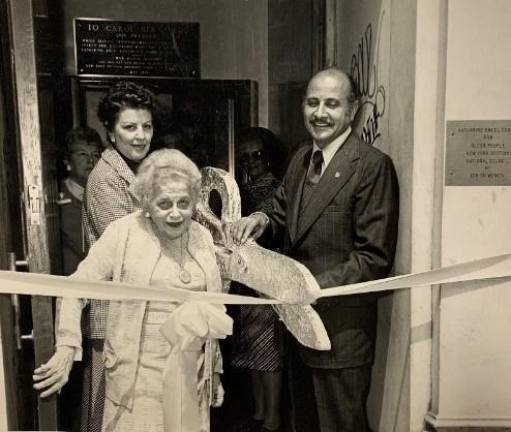 Former Manhattan Borough President Percy Sutton (right) cutting the ribbon at the dedication ceremony of the Katharine Engel Center for Older People in 1957.