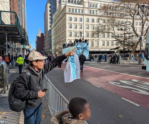 Fan waving a Gotham FC championship towel at the Nov. 24 parade.