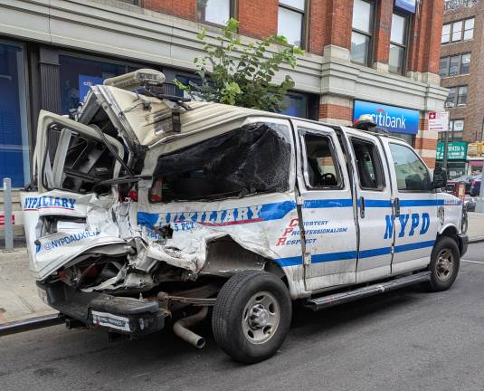 Fifth Precinct Auxiliary van parked on Elizabeth Street after the Malibu crash.