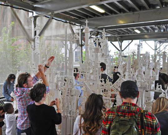 The Collectivity Project, built entirelly of Legos, incorporates variety including robots, buildings, names, religious symbols and lots more, in one contiguous design. Photos: Veronica Bruno