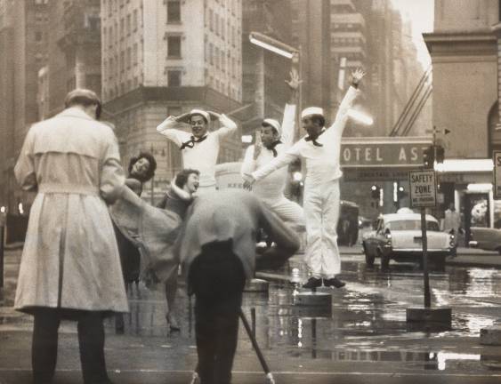 Gordon Parks (leaning over tripod) photographs original &#x201c;Fancy Free&#x201d; cast members Muriel Bentley, Janet Reed, Harold Lang, John Kriza and Jerome Robbins during a Times Square reunion in 1958. Silver gelatin print. Photographer unknown. Jerome Robbins Dance Division, The New York Public Library for the Performing Arts