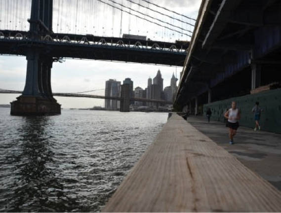The East River waterfront looking south at the Manhattan and Brooklyn bridges. A 68-story luxury tower that&#x2019;s being built at the foot of the Manhattan Bridge. Photo by Daniel Fitzsimmons