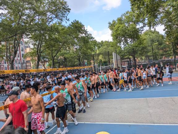 Players line up for post-game handshakes at Sara D. Roosevelt Park.