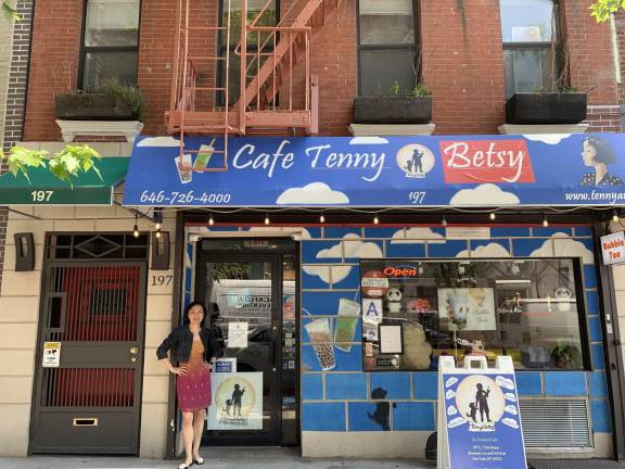 Tenny &amp; Betsy owner Jennifer Gal stands in front of her store.