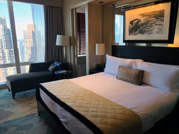 The western exposure of Mandarin Oriental New York room 4924 offers great sunsets, a bathroom that wraps around the back of the bed, and a view of the Hudson River. Below you, 11 floors down, are a spa, pool and workout area available to hotel guests. Photo: Ralph Spielman