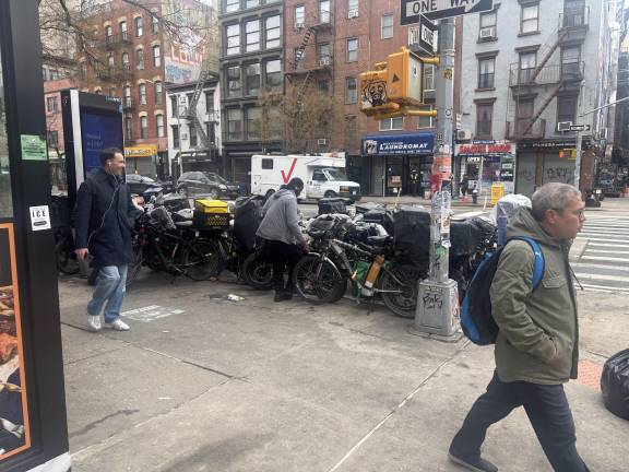 The bike gathering spot on E. 11th St. is spilling onto First Ave. as well in recent days.