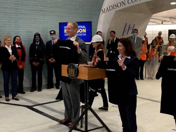 MTA Chair and CEO Janno Lieber and Governor Kathy Hochul receive tee shirts with the Grand Central Madison name at the new Long Island Rail Road Terminal. Photo: Ralph Spielman