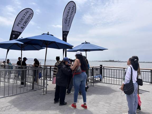 Visitors present tickets before entering the Statue City Cruises boarding area in Battery Park, which is the only ferry that lands on Liberty Island and the only one that is licensed by the city.