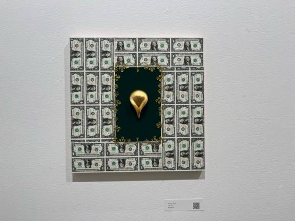 Ariane Rush’s “Me Too” features a golden vulva surrounded by $1 bills. Photo: Gaby Messino