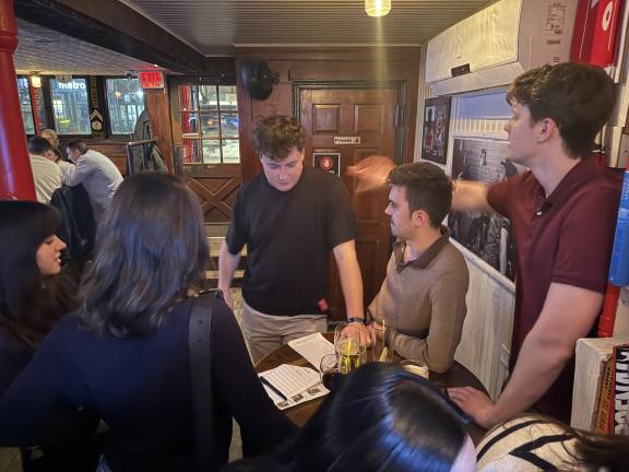 O’Hanlon’s patrons prepare for battle at the East Village bar’s weekly pub trivia competition hosted by Pete Sullivan, aka Quizmaster Pete.