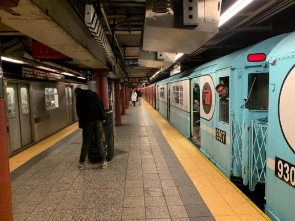 While the Nostalgia Train conductor waits for a clear signal, a regular express train pulls out of 72nd Street on the Seventh Avenue Line. The cars replicated the NY World’s Fair color scheme that was introduced for the 1964-65 Fair. Photo: Ralph Spielman
