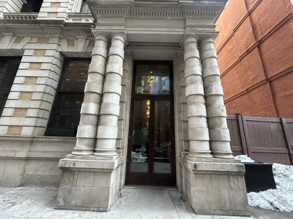 Outside the front entrance of the hotel that is now a migrant shelter