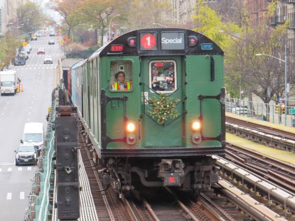 Ascending the incline from 122nd Street, the Train of Many Colors heads north towards the West 125th Station. The viaduct that goes from 122nd to 133rd Streets was part of the original 1904 NY Subway system. Photo: Ralph Spielman