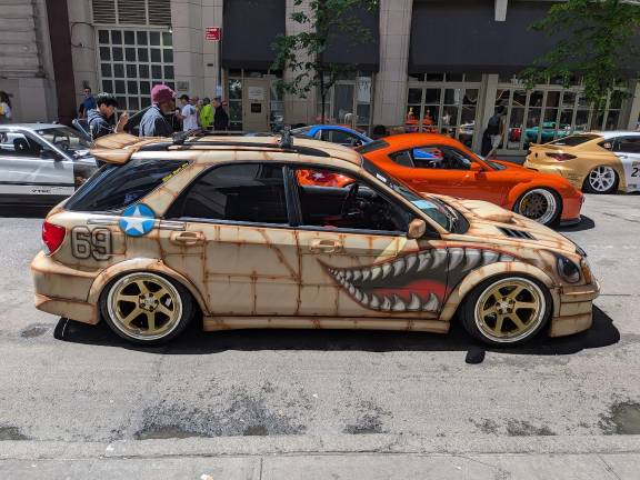 A custom Subaru at AAPI Parade and the DaikokuNYC organized car show within it.