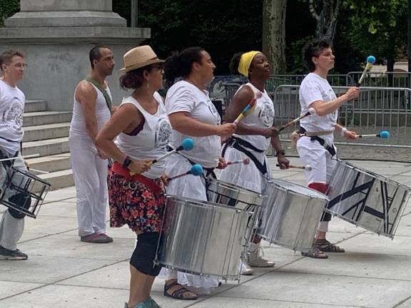 Mambembé Samba Reggae play Afro-Brazilian music entirely on drums. The front line shows their enthusiasm as they follow the beat of their conductor. Photo: Ralph Spielman