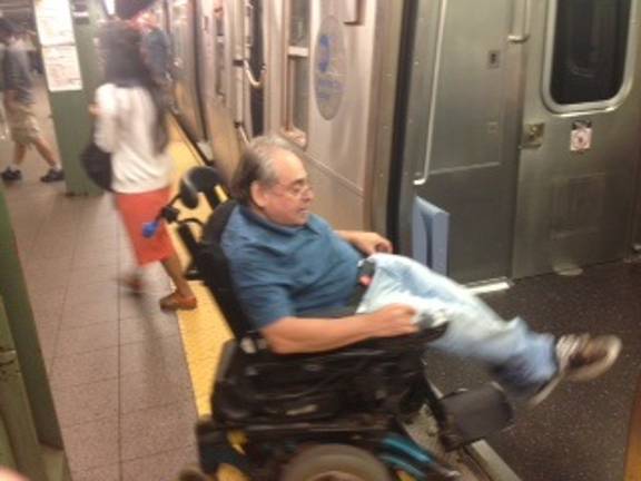 Todd Kreisler boards a subway train. Photo: William Engel.