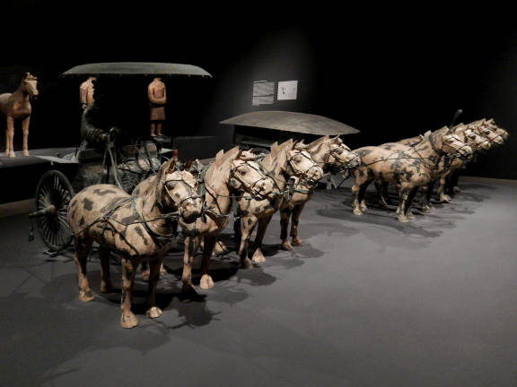 Half-sized horses and charioteers precede life-sized warriors excavated from Xian, China, and give a glimpse at one of the most important archeological finds of the century. Photo: Adel Gorgy