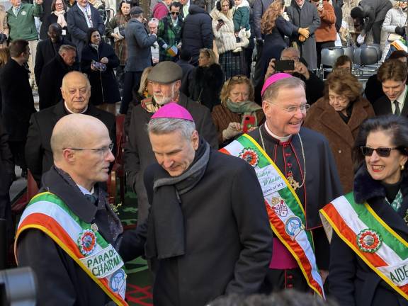 How am I doning? Sean Lane (left) Chairman of the St. Patrick’s Day Parade Foundation, confers with Archbishop Ronald Hicks, who presided over his first St. Patrick’s Day parade on March 17.