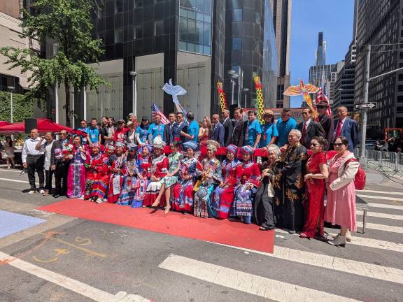 AAPI Parade dignitaries pose for photos at Sixth Avenue and 44th Street.