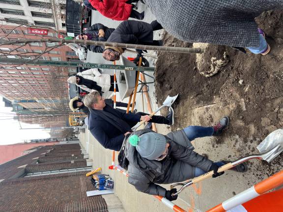 Council Member Bottcher grabbed a shovel to help pack in the trophy sapling.