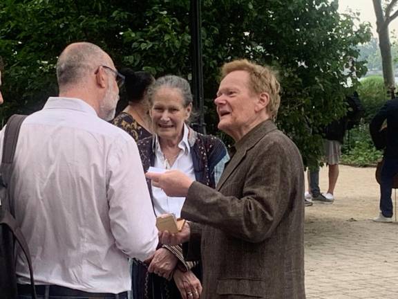 Before the kickoff performance of Saint-Saens’ “Carnival of the Animals,” famed tightrope walker Phillipe Petit (right) discusses a question with a media representative before reading a poem between musical passages. Photo: Ralph Spielman