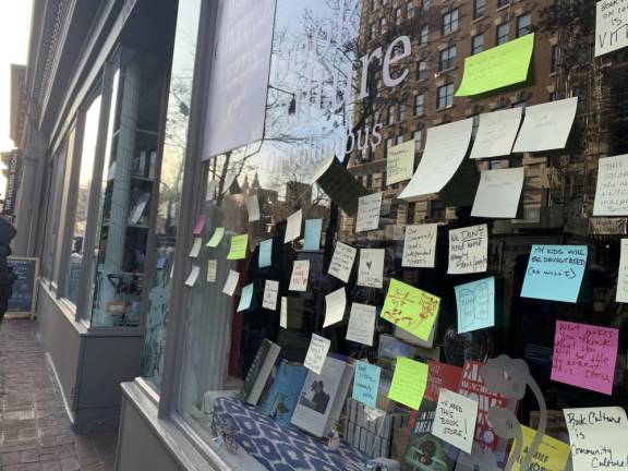 Book Culture's window was plastered with notes from concerned customers.