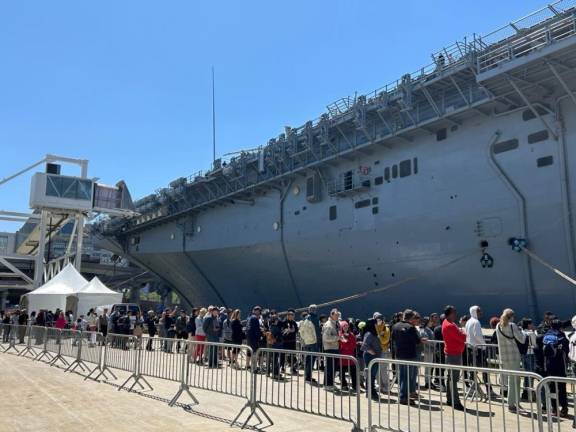 Tourists climb aboard USS Wasp during Fleet week celebration. Photo: Alessia Girardin