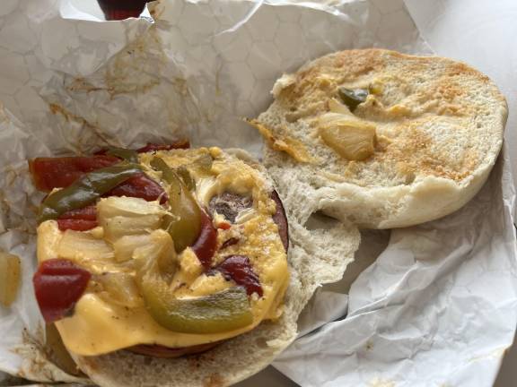 While you may opt for a hot dog or hamburger at Sahlen Field in Buffalo during an exciting baseball game, try the local choice; fried bologna sandwich on a roll, here with cheese, peppers, and onions. This combo is also available at some other food outlets in the Buffalo area.