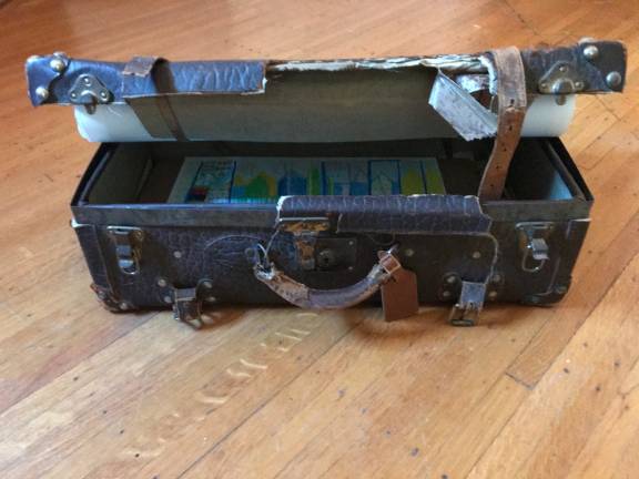 A suitcase, typically a symbol of arrival and of hope, takes on yet other, somber meaning as more immigrants are being deported. Photo courtesy of Lourdes Bernard