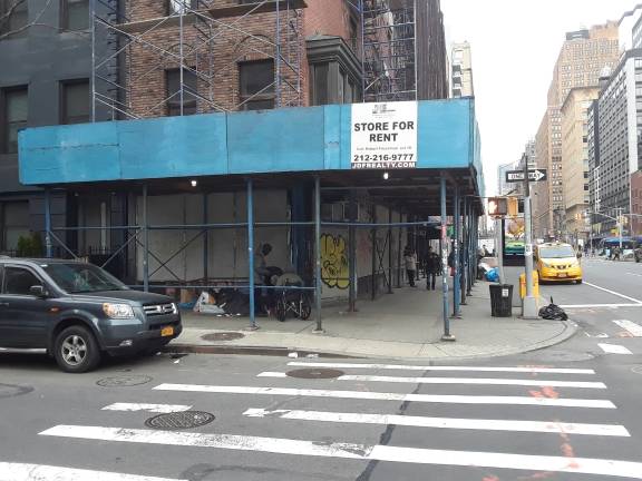 The sidewalk shed has long served as a destination for people who have chosen to live on the streets instead of seeking shelter. Photo: Scott Stiffler