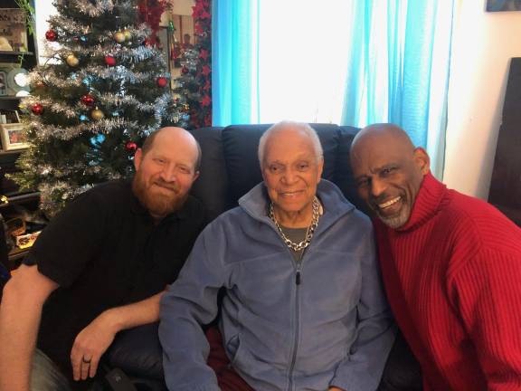 Team Nat: Nat Horne flanked by friends and former students, musician and actor Benjamin Magnuson (left) and dancer and dramaturg Stanley Harrison, just two members of the community responsible for creating and promoting the GoFundMe campaign to keep Horne in his home.