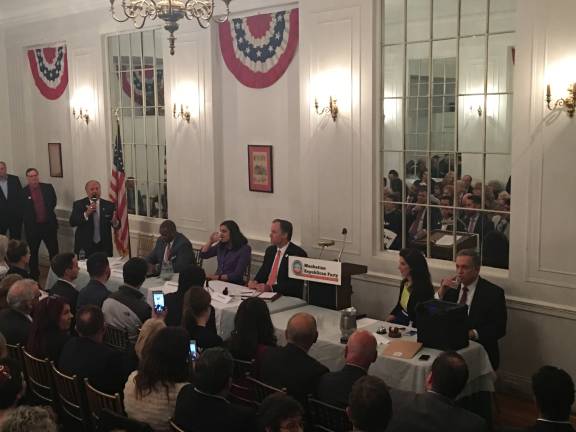 Bo Dietl, with the microphone, was among four Republicans candidates making their cases at the Metropolitan Club to be the GOP nominee in this year's mayoral contest. Other candidates at the Wednesday night forum were, from Dietl's left, Michel Faulkner, Nicole Malliotakis and Paul Massey. The Manhattan Republican Party's chairwoman, Adele Malpass, seated at right, moderated. Photo: Madeleine Thompson  