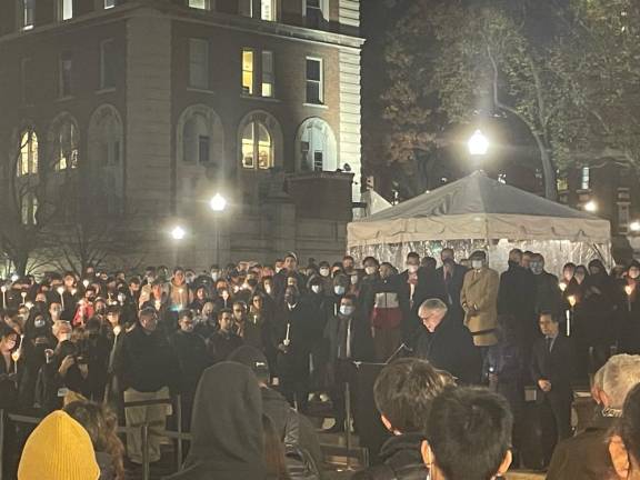 Columbia University President Lee Bollinger speaking at the Friday evening vigil for Davide Giri. Photo: Henry Quinn Pasin