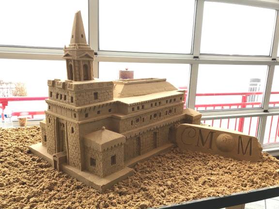 Sand rendering of the new Children's Museum by sculptor Matt Long. Photo: Carey Davis