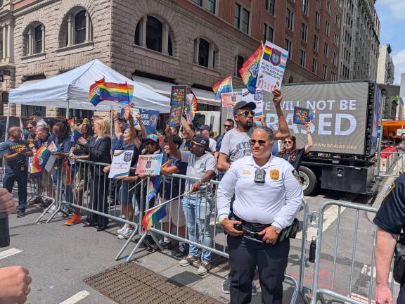 Gay Officers Action League watch the NYC Pride March from the sidelines at West 20th Street.
