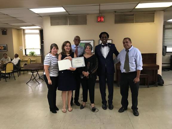 DFTA Commissioner Lorraine Cortés-Vázquez (center), State Senator Robert Jackson (back, left) and Assembly Member Al Taylor (back, right) at Riverstone Senior Life Senior Center.