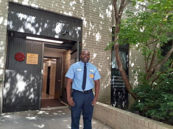 Jahdal Benjamin stands outside the service entrance on East 88th Street. Photo: Karen Camela Watson