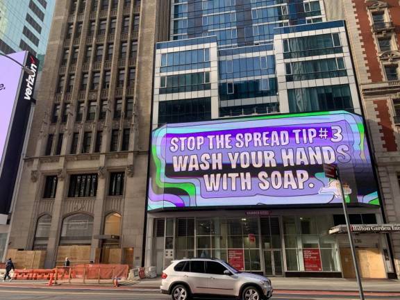 Message and boards in Times Square. Photo: Evando Thompson