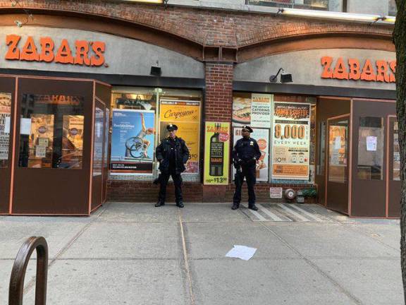 NYPD Auxiliary officers on duty outside Zabar's on Friday night, March 20, 2020.