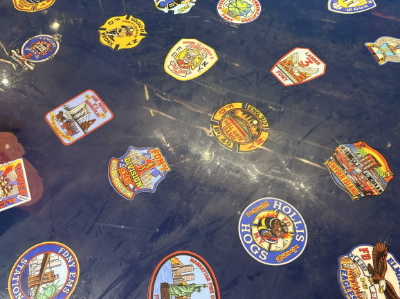 The new flooring at the Fire Museum’s entryway, representing FDNY and EMS houses across the city.