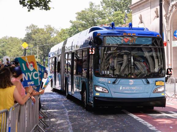 Causes for celebration: the MTA participated in the Hometown Heroes ticker-tape parade on Broadway on Wed., July 7, 2021. An articulated electric bus was featured. Photo: Marc A. Hermann / MTA