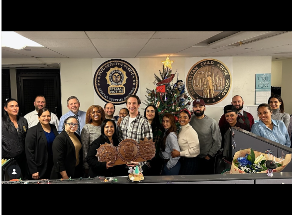 Allen Kirmss (center) the new commanding officer of the 17th Pct, was feted at his old job heading the child abuse squad of the Special Victims Unit when he was promoted from sergeant to lieutenant in 2024.