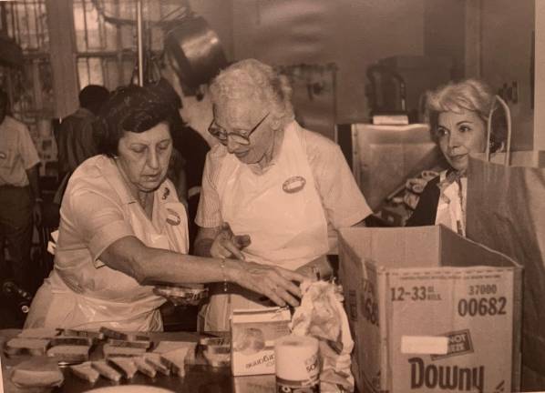 Volunteers preparing sandwiches at the opening day of the Hunger Program in 1983.